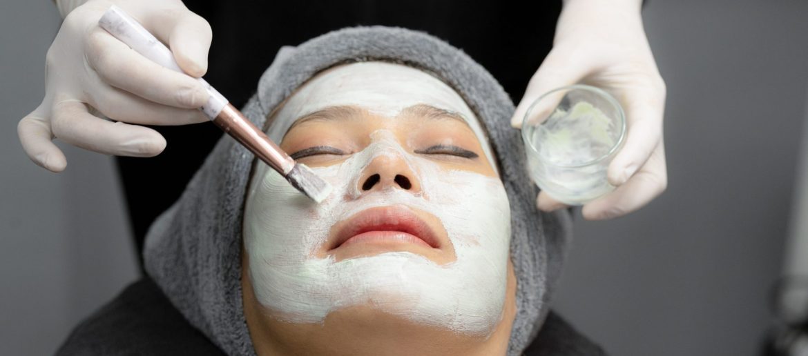 young-woman-cream-mask-facial-in-beauty-clinic-2023-11-27-05-18-35-utc